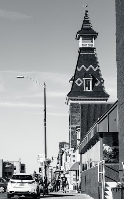 Black and white street scene in Kingston, Ontario, featuring iconic building architecture.